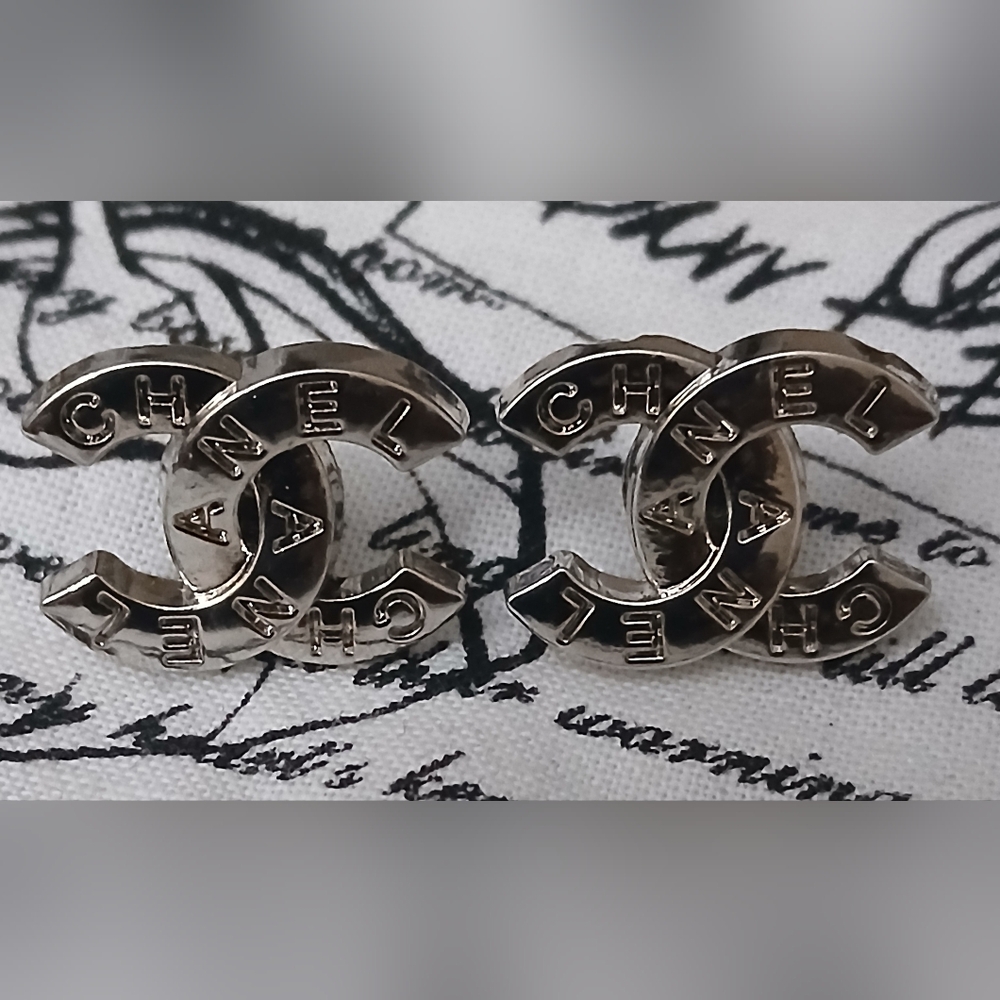 Chanel CC logo stud earrings in silver-tone metal with crystal